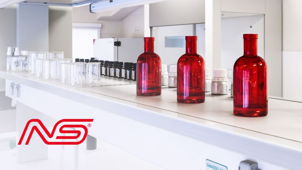 Laboratory with red bottles on the bench